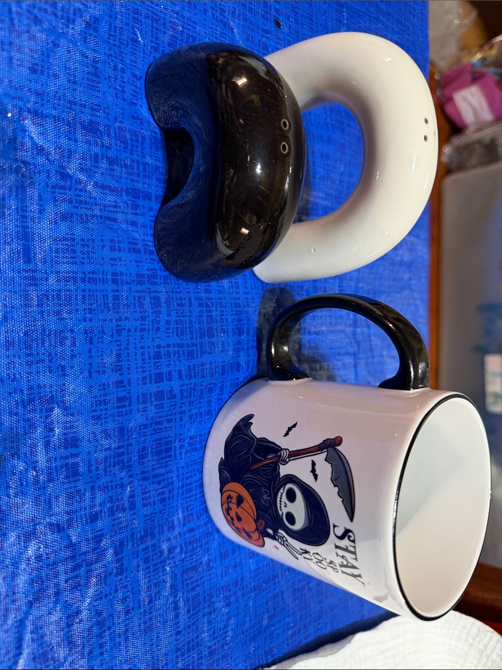 Black and White Ceramic Salt and Pepper Shakers with Black-Handled Halloween Mug